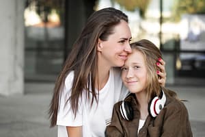 Happy Mother Raising Teens After Using Positive Parenting Tips And Mental Health Counseling